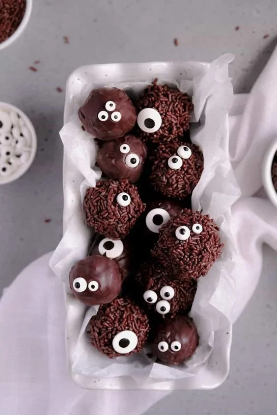 Delicious double chocolate brownie truffles displayed on a plate.