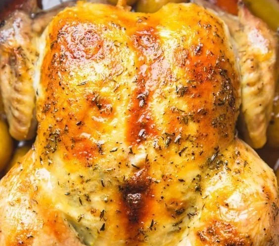 Dutch Oven Whole Chicken cooked to perfection with herbs and spices.