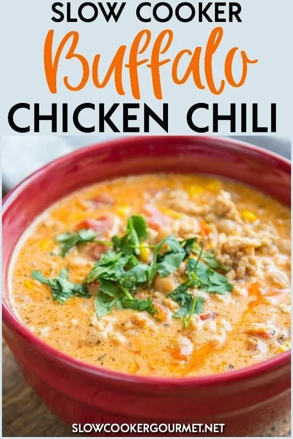 Bowl of slow cooker buffalo chicken chili topped with green onions and cheese