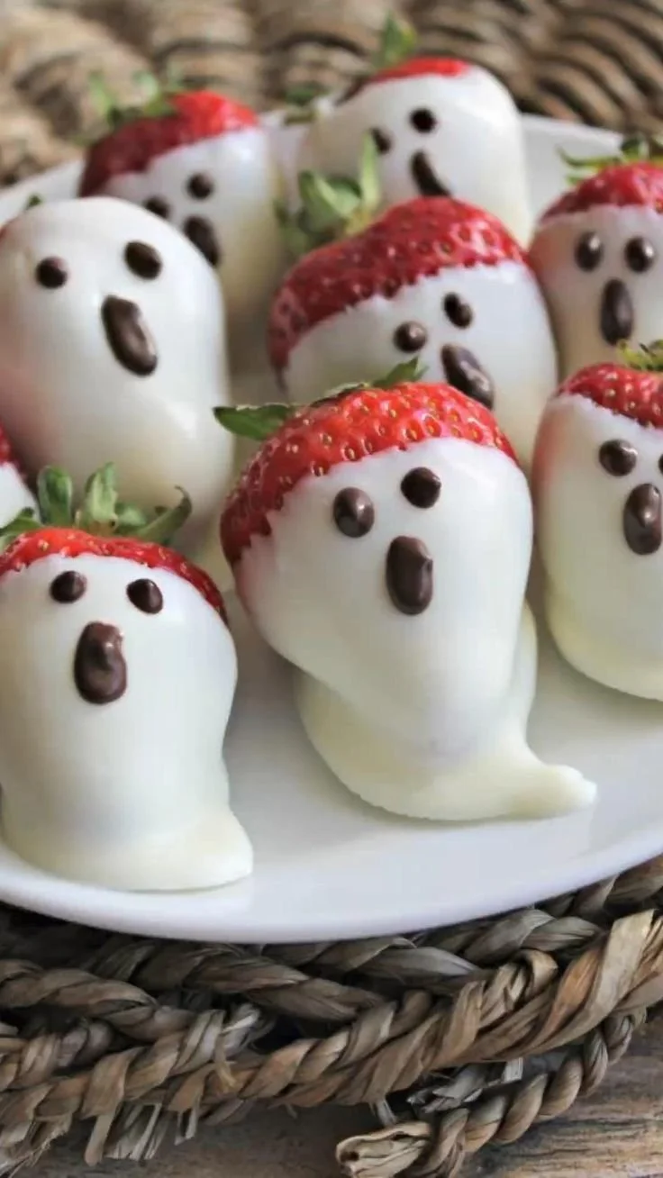 Delicious strawberry ghosts dessert for Halloween party